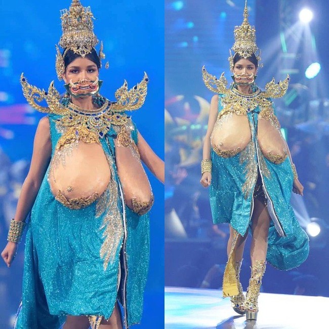 Bam Arisara berlenggak-lenggok di panggung penjurian Miss Universe Thailand 2020 dengan memakai kostum berwarna biru dan detail emas bak perisai pada bagian pundaknya. Dan di bagian dadanya tampak ditempel payudara buatan yang ukurannya super besar. Foto: Facebook Miss Universe Thailand