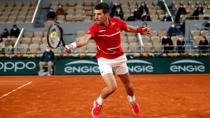 PARIS, FRANCE - OCTOBER 09: Novak Djokovic of Serbia plays a backhand during his Mens Singles semifinals match against Stefanos Tsitsipas of Greece on day thirteen of the 2020 French Open at Roland Garros on October 09, 2020 in Paris, France. (Photo by Clive Brunskill/Getty Images)