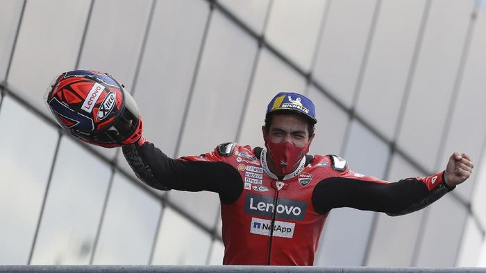 Danilo Petrucci Italian rider Danilo Petrucci of the Ducati Team celebrates on the podium after winning the MotoGP race of the French Motorcycle Grand Prix at the Le Mans racetrack, in Le Mans, France, Sunday, Oct. 11, 2020. (AP Photo/David Vincent)