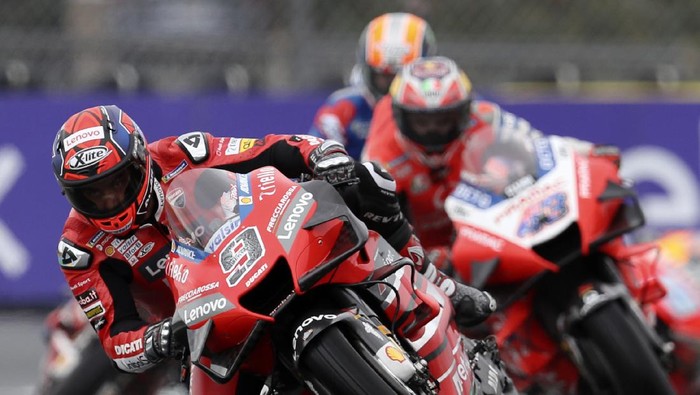Italian rider Danilo Petrucci of the Ducati Team steers his motorcycle followed by Australian rider Jack Miller of the Pramac Racing during the MotoGP race of the French Motorcycle Grand Prix at the Le Mans racetrack, in Le Mans, France, Sunday, Oct. 11, 2020. (AP Photo/David Vincent)