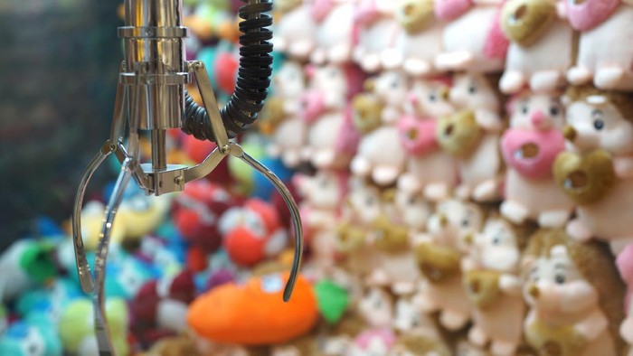 The doll sold in coin operating machine by using joystick to control the clamp to pull the doll up.