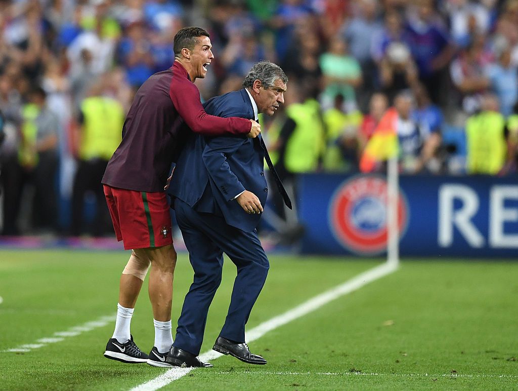 PARIS, FRANCE - JULY 10:  Manager Fernando Santos and Cristiano Ronaldo of Portugal celebrate winning at the final whistle during the UEFA EURO 2016 Final match between Portugal and France at Stade de France on July 10, 2016 in Paris, France.  (Photo by Laurence Griffiths/Getty Images)