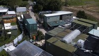 Kontainer-kontainer bekas itu berada di sepetak tanah seluas 1.000 meter persegi yang disewanya di Yuan Leng, Hong Kong.  