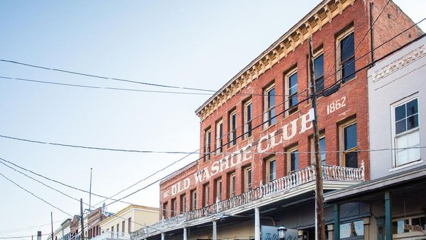 Virginia City, Nevada, USA - August 6, 2016: View of street along historic western mining town, Virginia City with view of Old Washoe Club.  Virginia City is a landmark mining town and a well visited tourist location.