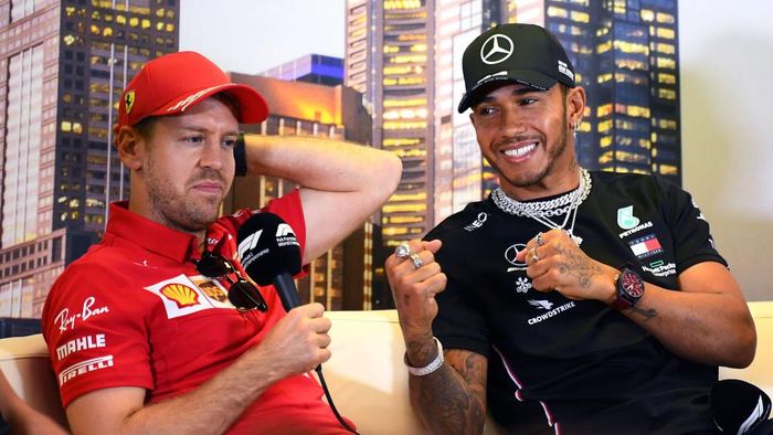 Lewis Hamilton, Sebastian Vettel MELBOURNE, AUSTRALIA - MARCH 12: Lewis Hamilton of Great Britain and Mercedes GP and Sebastian Vettel of Germany and Ferrari react during a press conference during previews ahead of the F1 Grand Prix of Australia at Melbourne Grand Prix Circuit on March 12, 2020 in Melbourne, Australia. (Photo by Clive Mason/Getty Images)