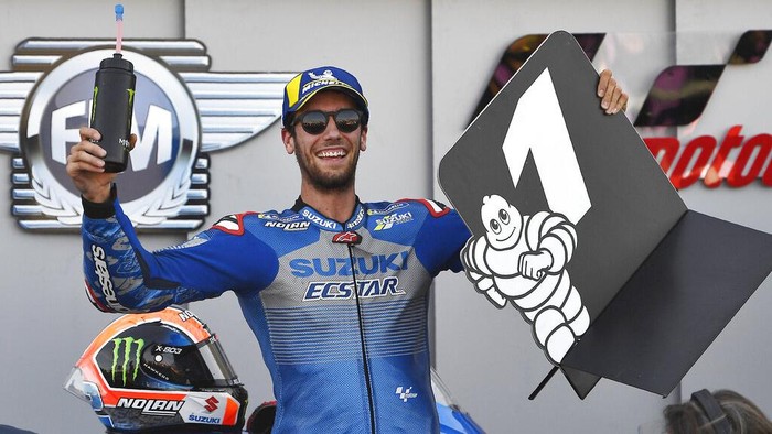 Suzuki rider Alex Rins, of Spain, celebrates after winning the Aragon Motorcycle Grand Prix at the Motorland circuit in Alcaniz, Spain, Sunday, Oct. 18, 2020. (AP Photo/Jose Breton)