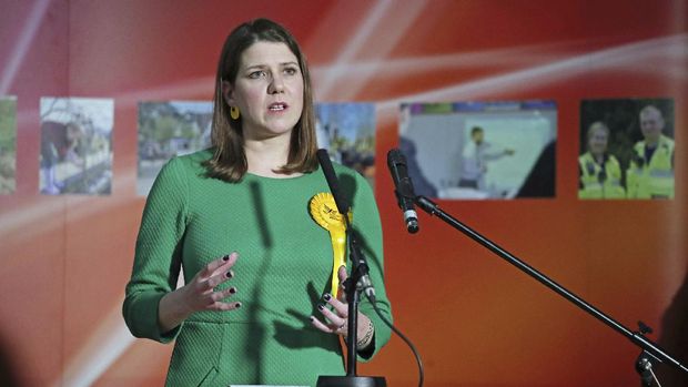 Lib Dem leader Jo Swinson, second right, reacts as she loses her East Dumbartonshire constituency, during the count at the Leisuredome, Bishopbriggs, Scotland, Friday Dec. 13, 2019.  (Jane Barlow/PA via AP)