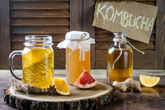 Homemade fermented raw kombucha tea with different flavorings. Healthy natural probiotic flavored drink. Copy space