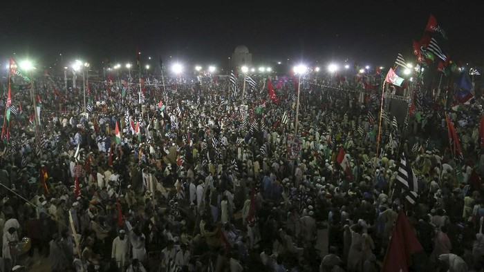 Supporters of the Pakistan Democratic Movement take part in an anti government rally in Karachi, Pakistan, Sunday, Oct. 18, 2020. Protests took place in a campaign against Prime Minister Imran Khan to force him step down over what they say is his failure in handling the nations ailing economy. (AP Photo/Fareed Khan)