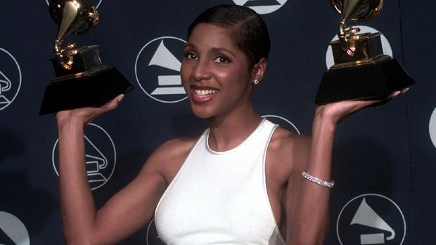 Tony Braxton holds her Best Female Pop Vocal Performance Award for 