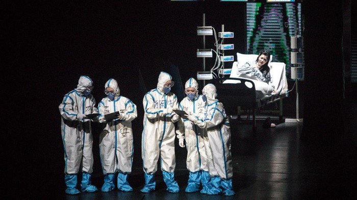 WUHAN, CHINA - OCTOBER 18: (CHINA OUT) The cast play nurses as they perform on stage during the opera 