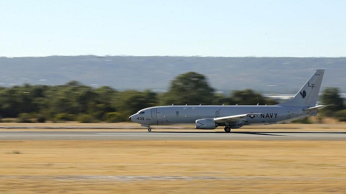 PERTH, AUSTRALIA - APRIL 07:  A US Navy Poseidon P-8 takes off to assist in the search for debris from missing Malaysia Airlines Flight MH370 at Perth International airport on April 7, 2014 in Perth, Australia. Angus Houston confirmed today that the Australian naval vessel Ocean Shield has twice detected signals in the past 24 hours consitent with aircraft black boxes. The airliner disappeared on March 8 with 239 passengers and crew on board and is suspected to have crashed into the southern Indian Ocean.  (Photo by Paul Kane/Getty Images)