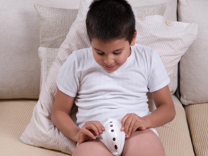 Little boy wearing protective underwear after circumcision.