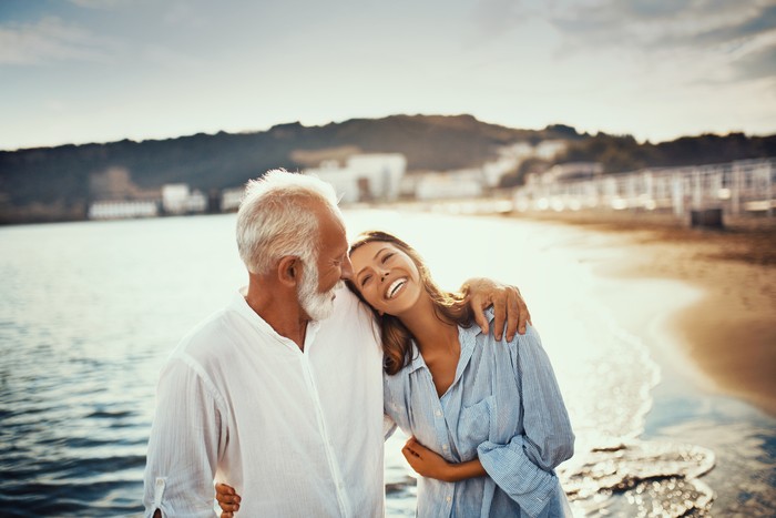 Man holding hands of woman in restaurant