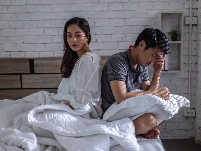 Lovers, they have problems with quarrel. They are in bed. they dont talk.Bored of life after marriage