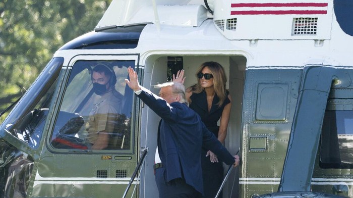President Donald Trump and first lady Melania Trump walk to board Marine One on the South Lawn of the White House, Thursday, Oct. 22, 2020, in Washington. Trump is headed to Nashville, Tenn., for a debate. (AP Photo/Alex Brandon)