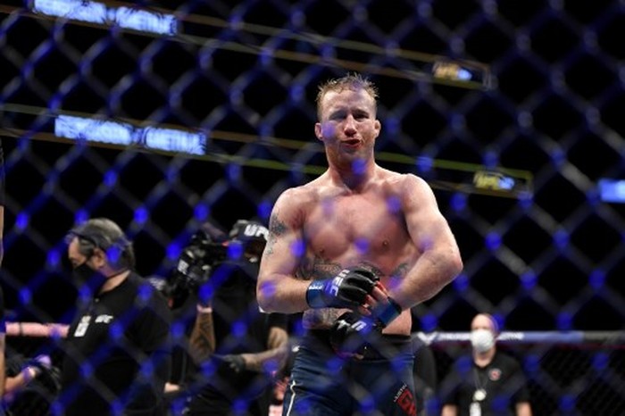 JACKSONVILLE, FLORIDA - MAY 09: Justin Gaethje of the United States celebrates after defeating Tony Ferguson of the United States in their Interim lightweight title fight during UFC 249 at VyStar Veterans Memorial Arena on May 09, 2020 in Jacksonville, Florida.   Douglas P. DeFelice/Getty Images/AFP