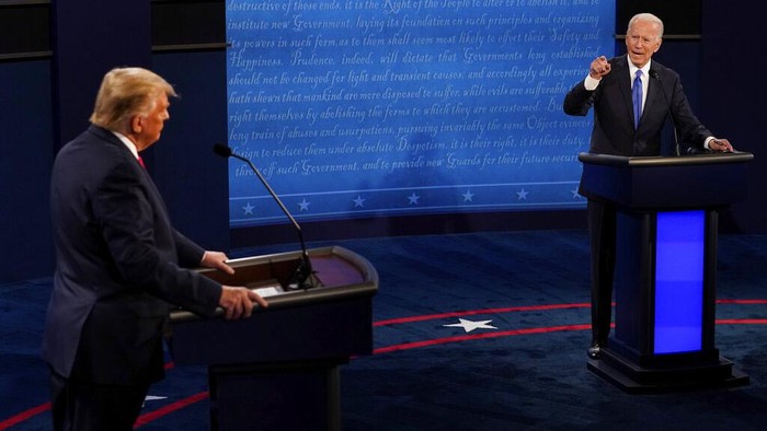 Democratic presidential candidate former Vice President Joe Biden points toward President Donald Trump during the second and final presidential debate Thursday, Oct. 22, 2020, at Belmont University in Nashville, Tenn. (AP Photo/Morry Gash, Pool)