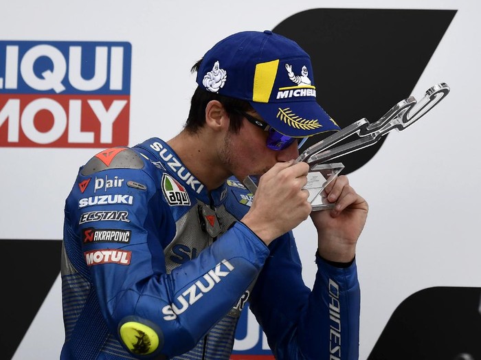 Third place Spains rider Joan Mir of the Team SUZUKI ECSTAR celebrates on the podium after the Motorcycle Grand Prix of Teruel in Alcaniz, Spain, Sunday, Oct. 25, 2020. (AP Photo/Jose Breton)