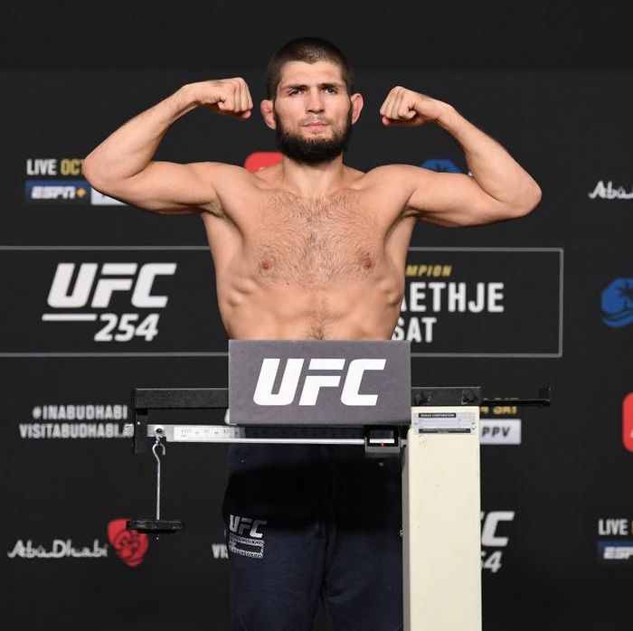 Khabib Nurmagomedov ABU DHABI, UNITED ARAB EMIRATES - OCTOBER 23: In this handout image provided by UFC, Khabib Nurmagomedov of Russia poses on the scale during the UFC 254 weigh-in on October 23, 2020 on UFC Fight Island, Abu Dhabi, United Arab Emirates. (Photo by Josh Hedges/Zuffa LLC via Getty Images)