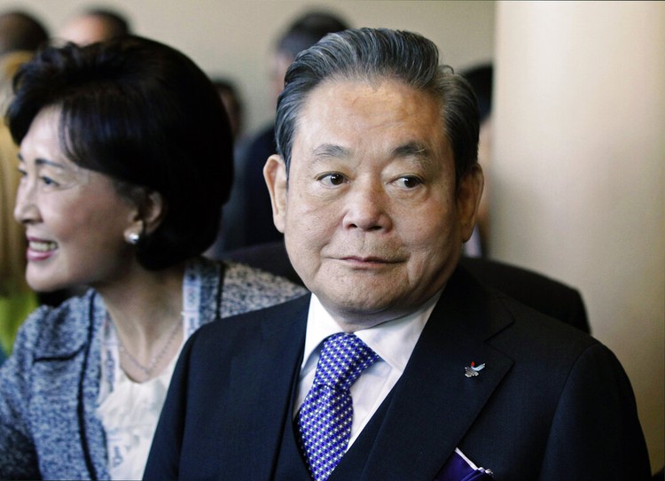 South Korea Obit Samsung Chief FILE - In this July 6, 2011, file photo, Samsung Chairman Lee Kun-hee, right, greets people from the South Korean delegation in Durban, South Africa, for the 123rd International Olympic Committee (IOC) session that will decide the host city for the 2018 Olympics Winter Games. Lee, the ailing Samsung Electronics chairman who transformed the small television maker into a global giant of consumer electronics, has died, a Samsung statement said Sunday, Oct. 25, 2020. He was 78. (AP Photo/Schalk van Zuydam, File)