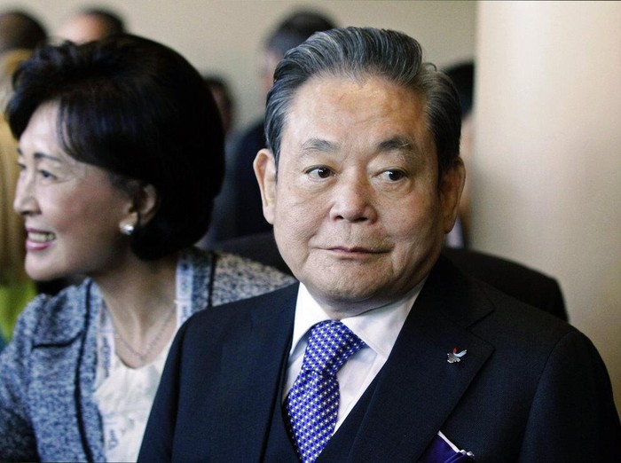 FILE - In this July 6, 2011, file photo, Samsung Chairman Lee Kun-hee, right, greets people from the South Korean delegation in Durban, South Africa, for the 123rd International Olympic Committee (IOC) session that will decide the host city for the 2018 Olympics Winter Games. Lee, the ailing Samsung Electronics chairman who transformed the small television maker into a global giant of consumer electronics, has died, a Samsung statement said Sunday, Oct. 25, 2020. He was 78. (AP Photo/Schalk van Zuydam, File)