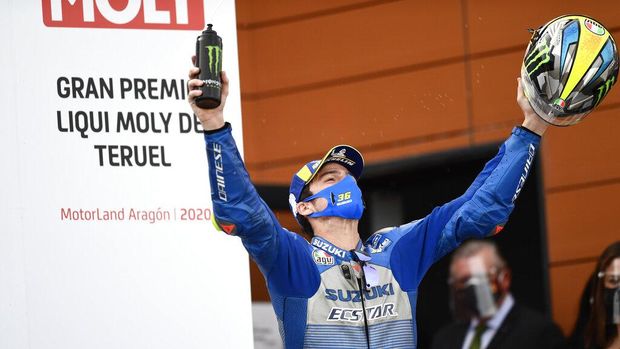 Third place Spain's rider Joan Mir of the Team SUZUKI ECSTAR celebrates on the podium after the Motorcycle Grand Prix of Teruel in Alcaniz, Spain, Sunday, Oct. 25, 2020. (AP Photo/Jose Breton)