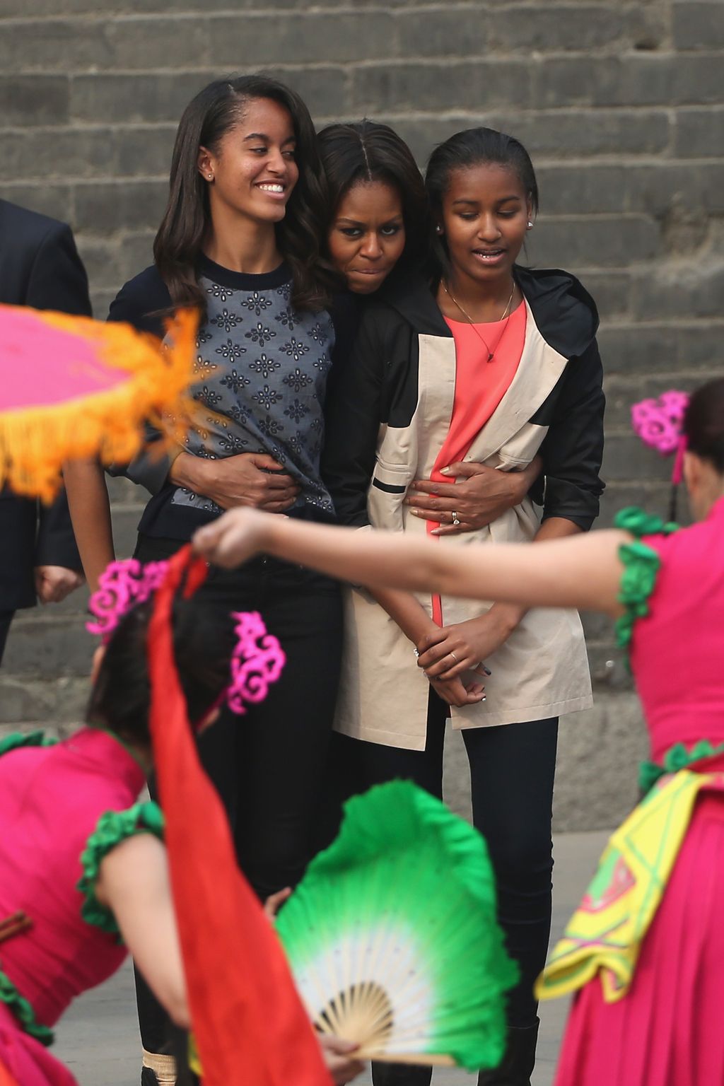 XI'AN, CHINA - MARCH 24:  First Lady Michelle Obama (Center) with her daughters Malia Obama (Left) and Sasha Obama (Right), mother Marian Robinson visit the Xi'an City Wall on March 24, 2014 in Xi'an, China. Michelle Obama's one-week-long visit in China will be focused on educational and cultural exchanges.  Michelle Obama's one-week-long visit in China will be focused on educational and cultural exchanges.  (Photo by Feng Li/Getty Images)