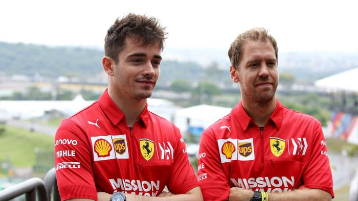 Charles Leclerc and Sebastian Vettel SAO PAULO, BRAZIL - NOVEMBER 14: Charles Leclerc of Monaco and Ferrari and Sebastian Vettel of Germany and Ferrari pose for a photo in the Paddock during previews ahead of the F1 Grand Prix of Brazil at Autodromo Jose Carlos Pace on November 14, 2019 in Sao Paulo, Brazil. (Photo by Charles Coates/Getty Images)