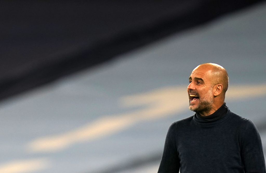 Pep Guardiola Manchester City's head coach Pep Guardiola gives instructions to his players during the Champions League group C soccer match between Manchester City and FC Porto at the Etihad stadium in Manchester, England, Wednesday, Oct. 21, 2020. (Tim Keeton/Pool via AP)