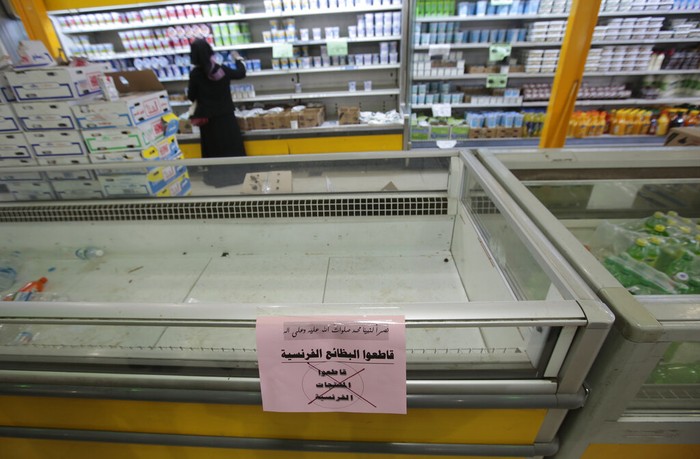 A notice calling for a boycott French products is displayed at a supermarket in Sanaa, Yemen, Monday, Oct. 26, 2020. Muslims in the Middle East and beyond on Monday called for boycotts of French products and for protests over caricatures of the Prophet Muhammad they deem insulting and blasphemous, but Frances president has vowed his country will not back down from its secular ideals and defense of free speech. (AP Photo/Hani Mohammed)