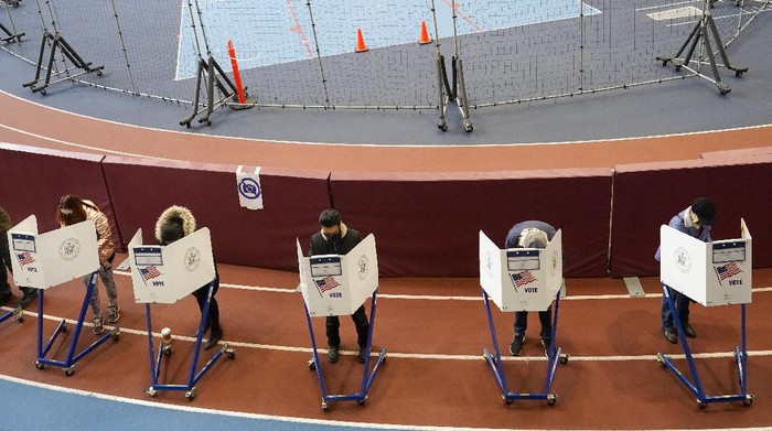 Voters mark their ballots during early voting at the Park Slope Armory YMCA, Tuesday, Oct. 27, 2020, in the Brooklyn borough of New York. (AP Photo/Mary Altaffer)