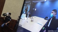 Rekan Pinangki Sirna Malasari, Andi Irfan Jaya menjalani sidang dakwaan secara virtual di PN Jakarta Pusat, Jalan Bungur Besar Raya, Jakpus, Rabu (4/11/2020).