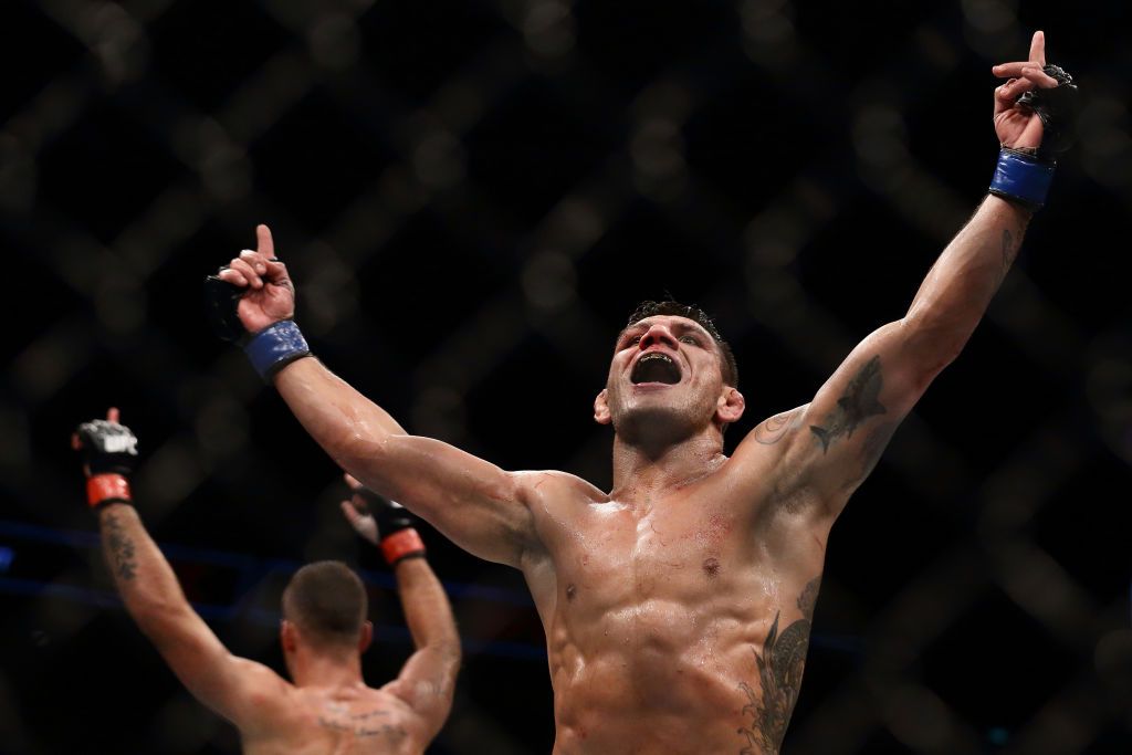 SINGAPORE - JUNE 17: Rafael dos Anjos of Brazil (R) and  Tarec Saffiedine of Belgium (L) reacts at the end of  the Welterweight Bout during UFC Singapore Fight Night at Singapore Indoor Stadium on June 17, 2017 in Singapore.  (Photo by Suhaimi Abdullah/Getty Images)