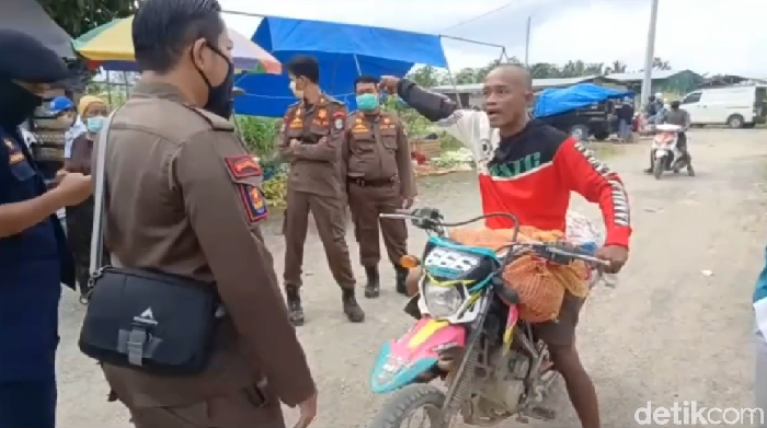 Viral pria di Mamuju ngamuk saat terjaring razia masker. Dia mengaku tak percaya Corona ada (Screenshot video viral)