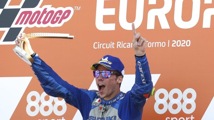 Spains rider Joan Mir of the Team SUZUKI ECSTAR celebrates his victory on the podium after wining the MotoGP race during the European Grand Prix in Valencia, Spain, Sunday, Nov. 8, 2020. (AP Photo/Alberto Saiz)