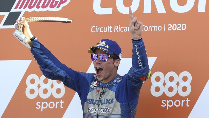 Spains rider Joan Mir of the Team SUZUKI ECSTAR celebrates his victory on the podium after wining the MotoGP race during the European Grand Prix in Valencia, Spain, Sunday, Nov. 8, 2020. (AP Photo/Alberto Saiz)