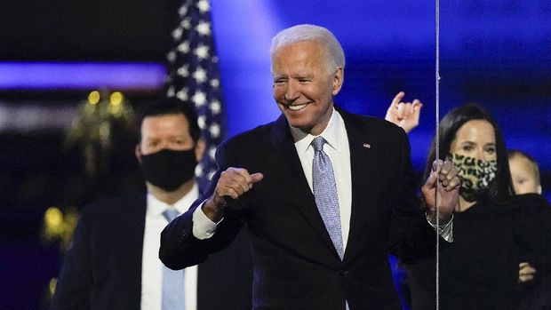 President-elect Joe Biden reacts as he stands on stage after speaking Saturday, Nov. 7, 2020, in Wilmington, Del. (AP Photo/Andrew Harnik)