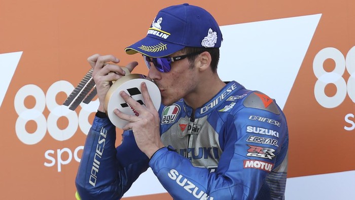 Spains rider Joan Mir of the Team SUZUKI ECSTAR celebrates his victory on the podium after wining the MotoGP race during the European Grand Prix in Valencia, Spain, Sunday, Nov. 8, 2020. (AP Photo/Alberto Saiz)