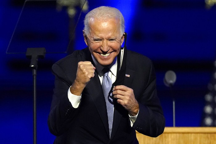 President-elect Joe Biden joins Vice President-elect Kamala Harris on stage Saturday, Nov. 7, 2020, in Wilmington, Del. (AP Photo/Andrew Harnik, Pool)