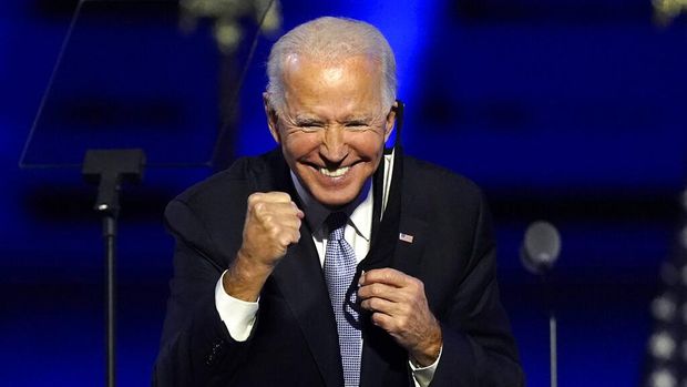 President-elect Joe Biden joins Vice President-elect Kamala Harris on stage Saturday, Nov. 7, 2020, in Wilmington, Del. (AP Photo/Andrew Harnik, Pool)
