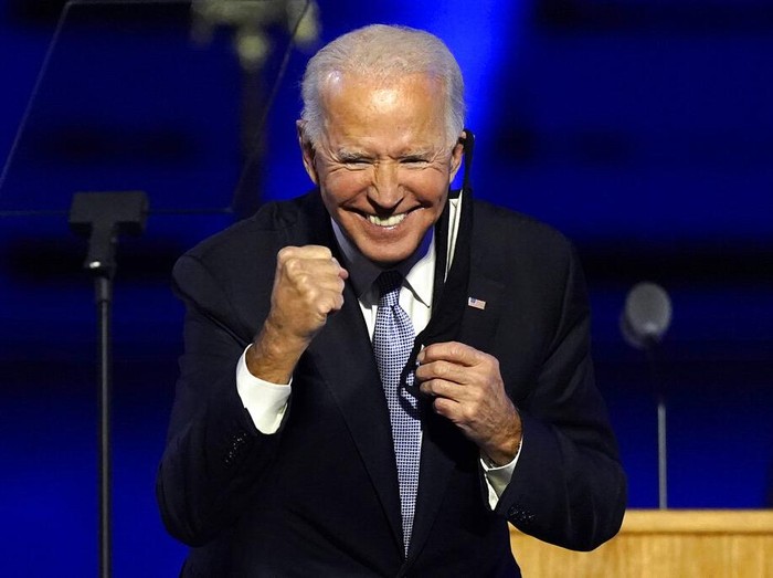 President-elect Joe Biden joins Vice President-elect Kamala Harris on stage Saturday, Nov. 7, 2020, in Wilmington, Del. (AP Photo/Andrew Harnik, Pool)