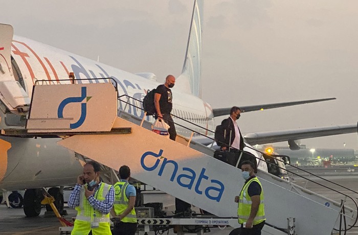 Israeli tourists leave a flydubai plane which departed from Ben-Gurion International Airport in Tel Aviv and landed in Dubai, United Arab Emirates, Sunday, Nov. 8, 2020. The first flight carrying Israeli tourists to the UAE landed Sunday in the city-state of Dubai, the latest sign of the normalization deal reached between the two nations. (AP Photo/Malak Harb)