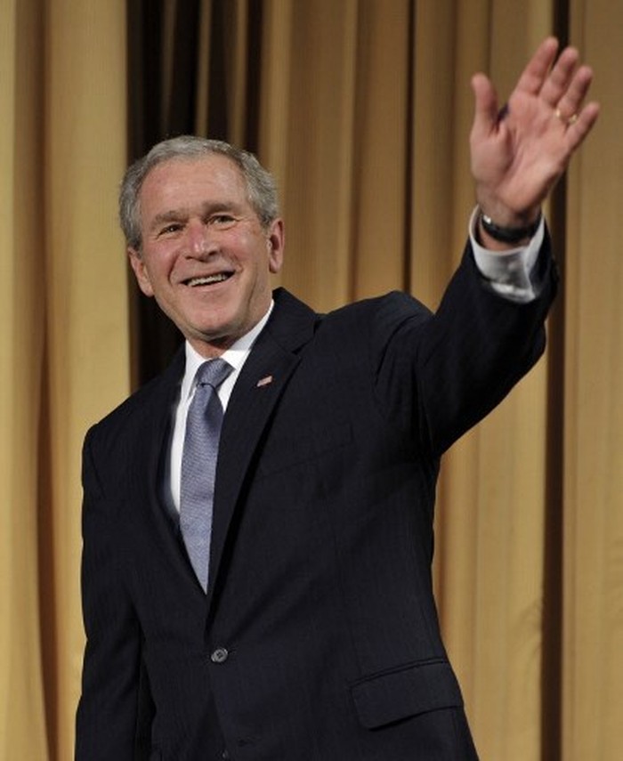 US President George W. Bush waves at the 2008 Bishop John T. Walker Memorial Dinner after receiving the Distinguished Humanitarian Service Award in Washington, DC on November 12, 2008. AFP PHOTO/YURI GRIPAS (Photo by YURI GRIPAS / AFP)
