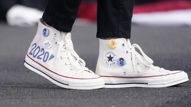 Democratic vice presidential candidate Sen. Kamala Harris, D-Calif., wears Converse high-top sneakers while she speaks at a drive-in early voting event, Saturday, Oct. 31, 2020, in Miami, Fla. (AP Photo/Wilfredo Lee)