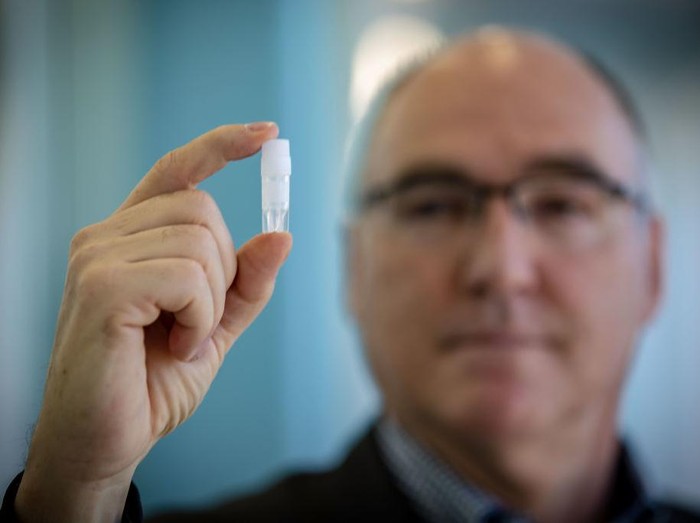 MELBOURNE, AUSTRALIA - NOVEMBER 08: CSL’s Chief Scientific Officer, Dr Andrew Nash shows a small vial which indicates the size of the iml of cells that will go into the bioreactor to create 30 ml doses of the AstraZeneca vaccine. November 08, 2020 in Melbourne, Australia. CSL will begin manufacturing AstraZeneca-Oxford University COVID-19 vaccine from Monday. (Photo by Darrian Traynor/Getty Images)