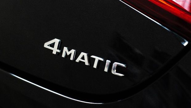 4matic icon on a black modern car, all-wheel drive car concept, transport
