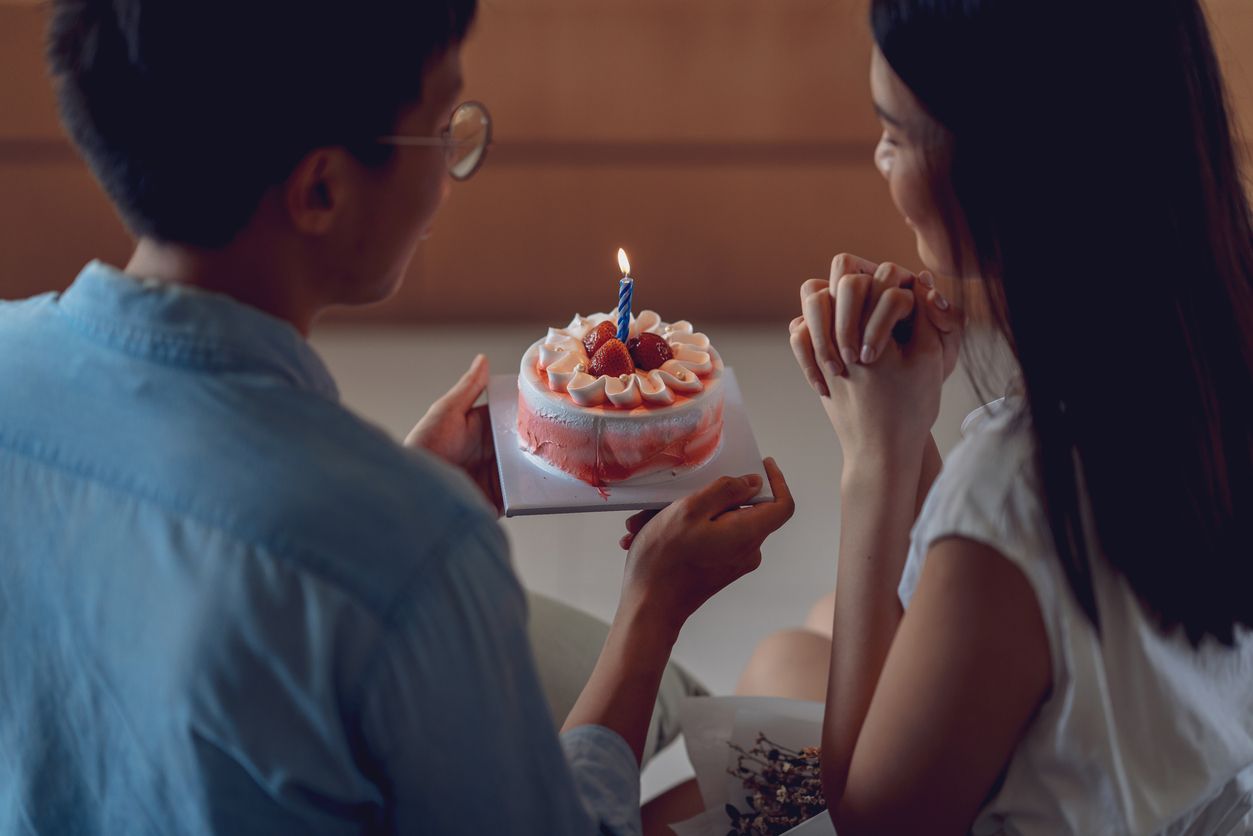 Young asian couple celebrating a private and simple birthday event at home