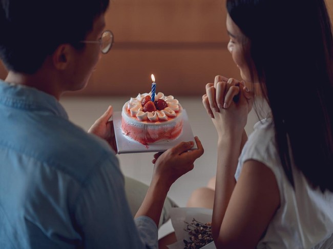 Young asian couple celebrating a private and simple birthday event at home