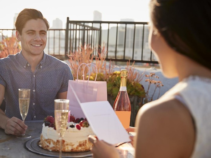 Pacar Ulang Tahun Young asian couple celebrating a private and simple birthday event at home